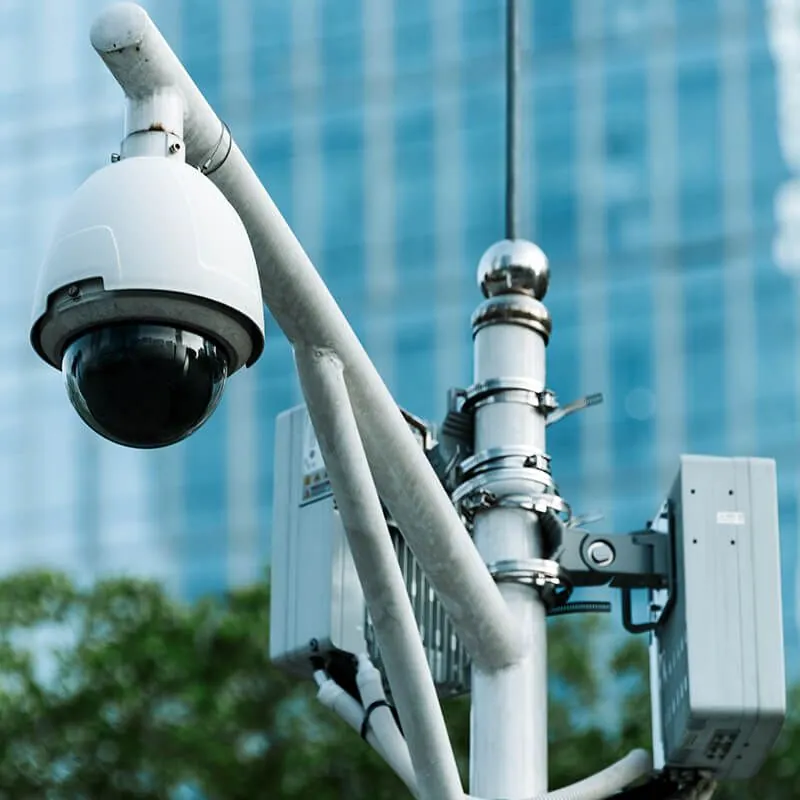 PTZ security camera mounted on a pole at a commercial site in Dubai