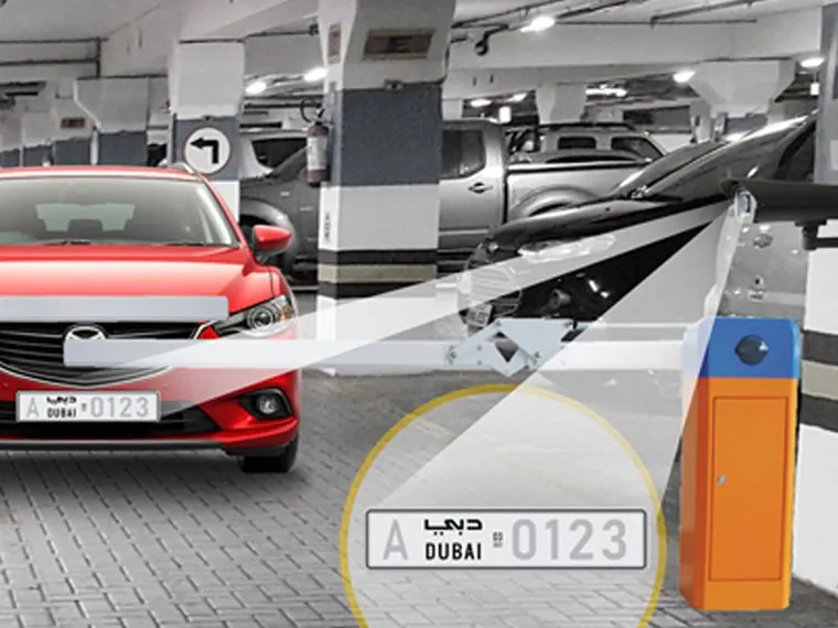 ANPR camera reading a Dubai number plate at a car park barrier
