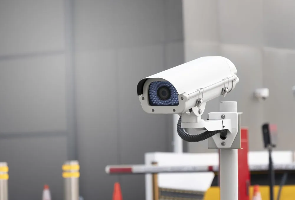 SIRA approved bullet CCTV camera covering a vehicle barrier entrance in Dubai